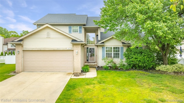 18615 Andrew Ln, New Boston, MI 48164 - townhome / multi-family property featuring concrete driveway, an attached garage, a shingled roof, and brick siding