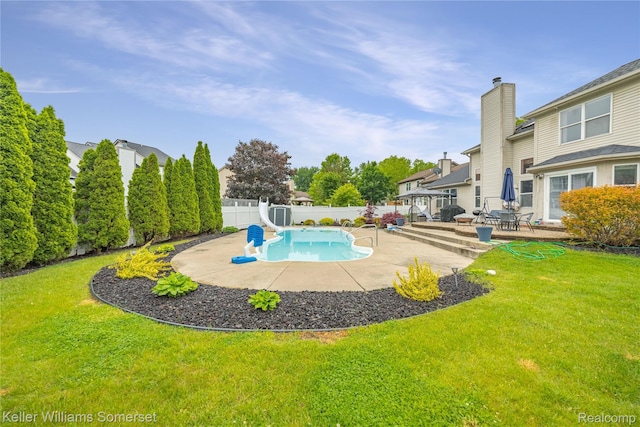 18615 Andrew Ln, New Boston, MI 48164 - view of swimming pool with a water slide and a patio area