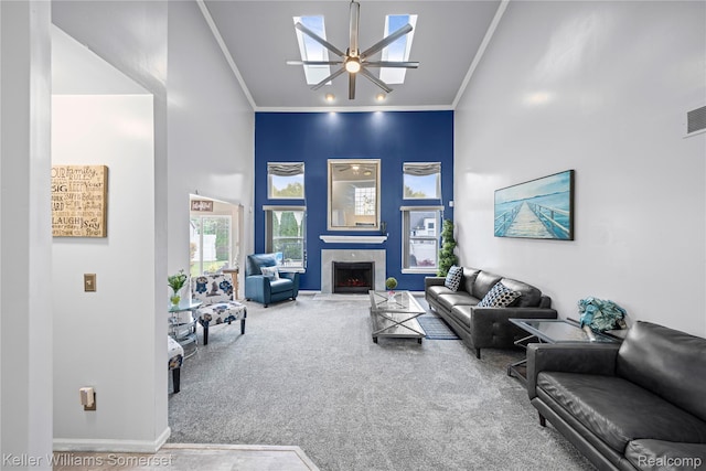 18615 Andrew Ln, New Boston, MI 48164 - living area with ceiling fan, carpet flooring, crown molding, a towering ceiling, and baseboards
