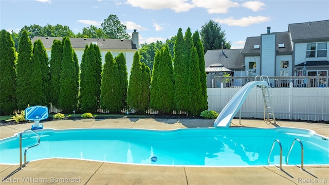 18615 Andrew Ln, New Boston, MI 48164 - view of pool featuring a water slide and a fenced backyard