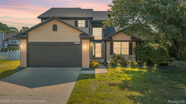 18615 Andrew Ln, New Boston, MI 48164 - view of front of house with driveway, brick siding, and an attached garage