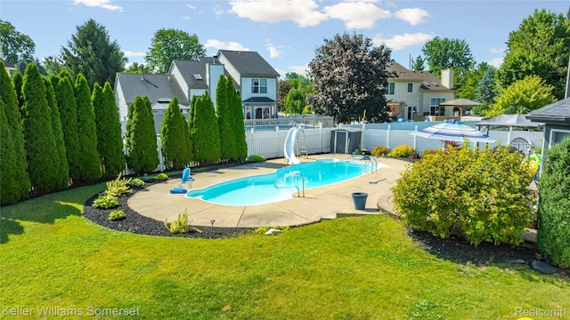 18615 Andrew Ln, New Boston, MI 48164 - view of swimming pool with a water slide, a fenced backyard, a patio area, and a residential view