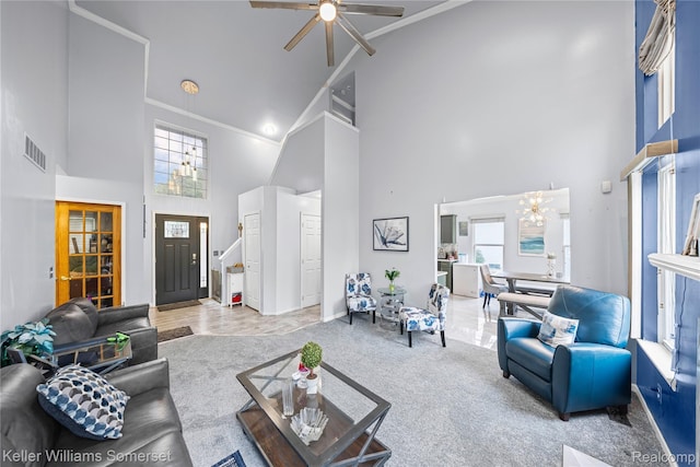 18615 Andrew Ln, New Boston, MI 48164 - carpeted living room featuring high vaulted ceiling, ceiling fan, a chandelier, and crown molding