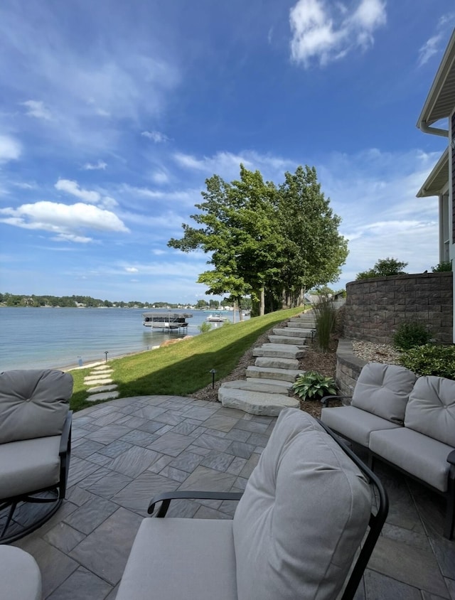 333 S W Silver Lake Rd, Michigan, MI 49685 - view of patio / terrace with a water view and outdoor lounge area