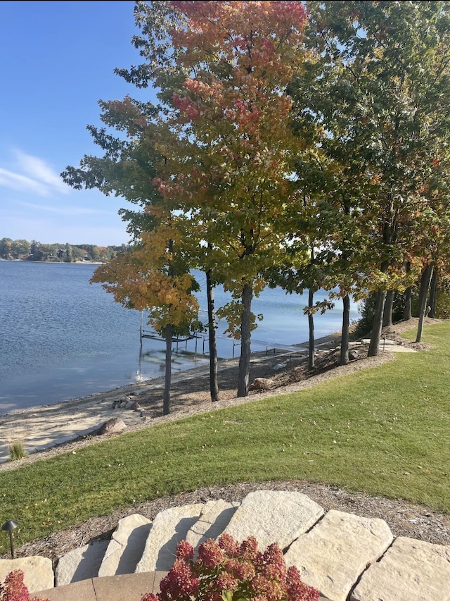 333 S W Silver Lake Rd, Michigan, MI 49685 - view of community featuring a water view and a lawn