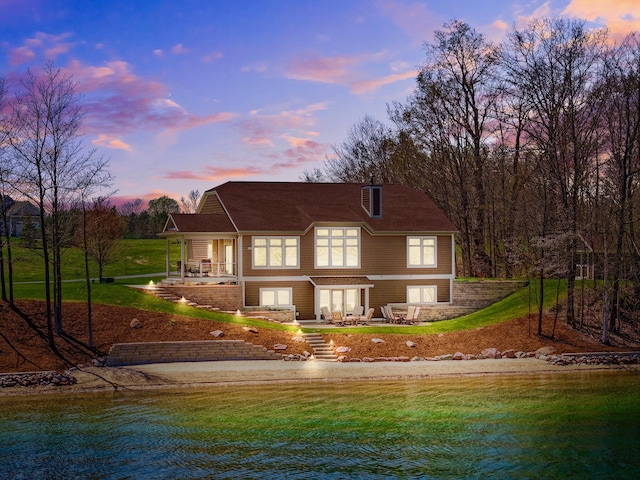 333 S W Silver Lake Rd, Michigan, MI 49685 - back of property with a patio and a yard