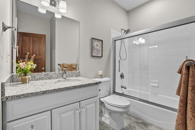 333 S W Silver Lake Rd, Michigan, MI 49685 - bathroom with vanity, toilet, and enclosed tub / shower combo