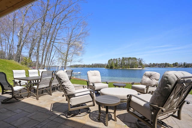 333 S W Silver Lake Rd, Michigan, MI 49685 - view of patio / terrace with a water view and outdoor dining area