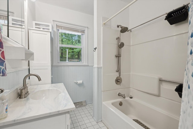 5245 Puetz Rd, Stevensville, MI 49127 - full bath with shower / bath combo with shower curtain, a wainscoted wall, tile patterned flooring, and vanity