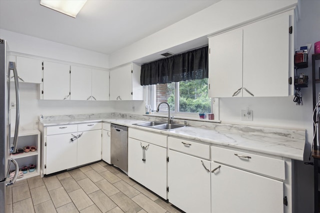 5245 Puetz Rd, Stevensville, MI 49127 - kitchen featuring a sink, appliances with stainless steel finishes, light countertops, and white cabinets