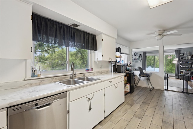 5245 Puetz Rd, Stevensville, MI 49127 - kitchen featuring dishwasher, a sink, light countertops, white cabinetry, and ceiling fan