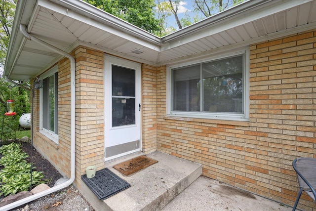 5245 Puetz Rd, Stevensville, MI 49127 - doorway to property featuring brick siding