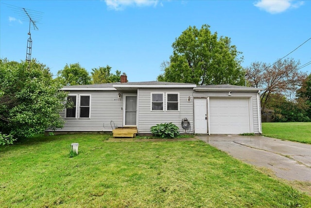 4020 Red Wing Dr, Flint, MI 48532 - view of front of home featuring concrete driveway, an attached garage, a chimney, and a front yard