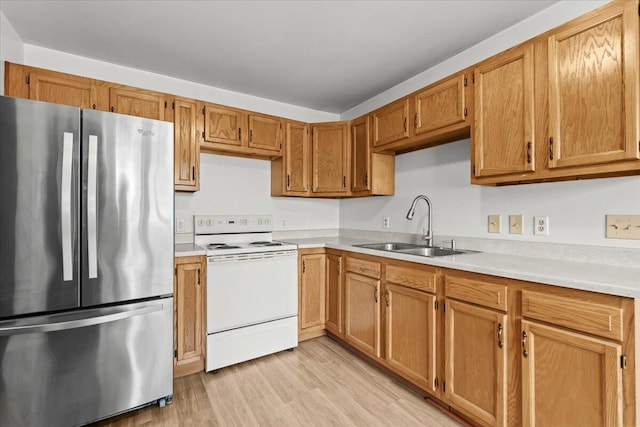 4020 Red Wing Dr, Flint, MI 48532 - kitchen with freestanding refrigerator, electric range, a sink, and light countertops