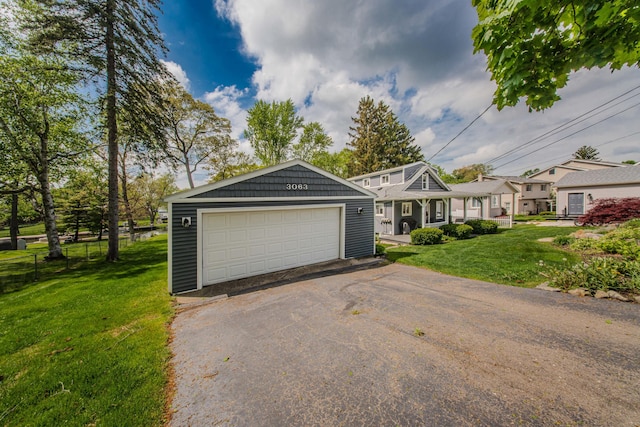 3063 Lansdowne Rd, Waterford, MI 48329 - view of front of home with a front lawn and a detached garage