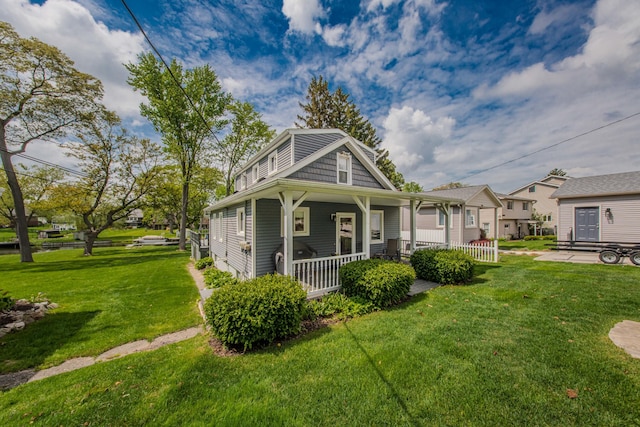 3063 Lansdowne Rd, Waterford, MI 48329 - view of front facade featuring covered porch and a front yard