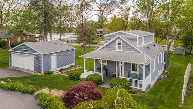 3063 Lansdowne Rd, Waterford, MI 48329 - view of front of home with covered porch, roof with shingles, an outdoor structure, and a front lawn