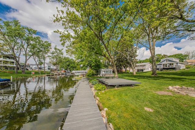 3063 Lansdowne Rd, Waterford, MI 48329 - dock area with a lawn, a water view, and a residential view