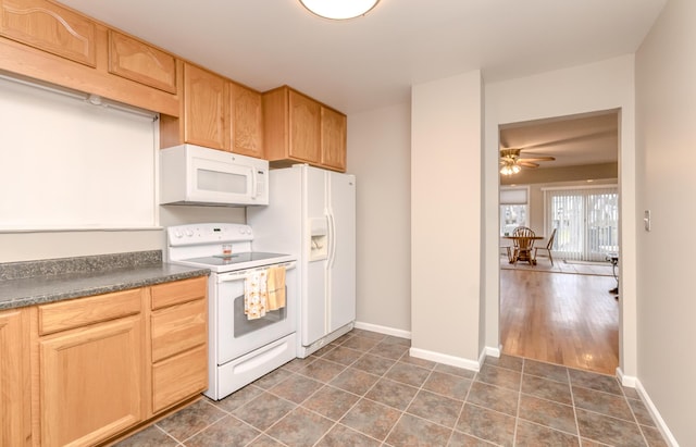 3063 Lansdowne Rd, Waterford, MI 48329 - kitchen featuring white appliances, dark countertops, light brown cabinetry, and ceiling fan
