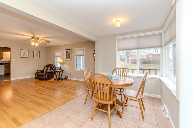 3063 Lansdowne Rd, Waterford, MI 48329 - dining room with ceiling fan, light wood-style floors, and baseboards