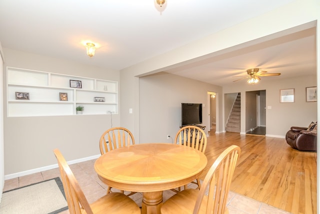 3063 Lansdowne Rd, Waterford, MI 48329 - dining room featuring stairway, light tile patterned floors, baseboards, and ceiling fan