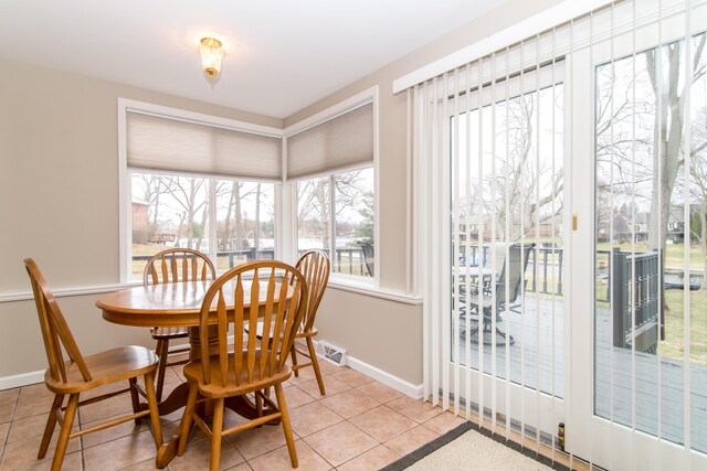 3063 Lansdowne Rd, Waterford, MI 48329 - tiled dining area featuring baseboards