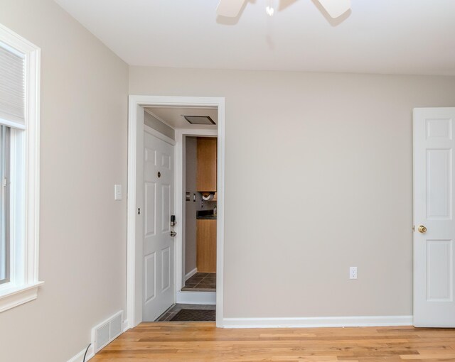 3063 Lansdowne Rd, Waterford, MI 48329 - empty room featuring light wood-type flooring, baseboards, and a ceiling fan