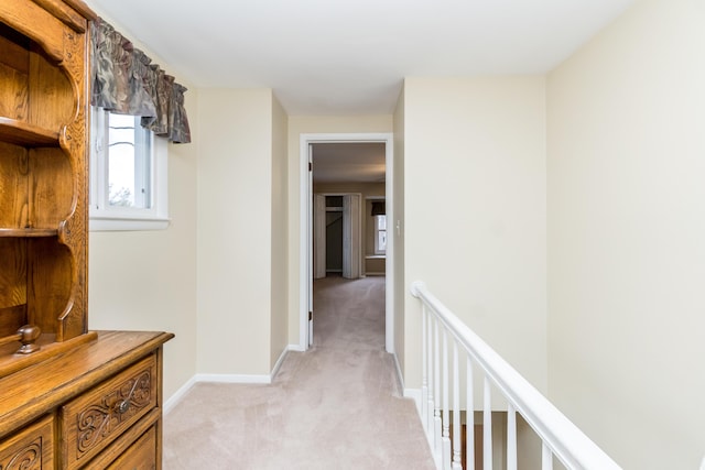 3063 Lansdowne Rd, Waterford, MI 48329 - hallway with light colored carpet, plenty of natural light, an upstairs landing, and baseboards