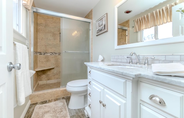 3063 Lansdowne Rd, Waterford, MI 48329 - full bathroom with vanity, a shower stall, and toilet