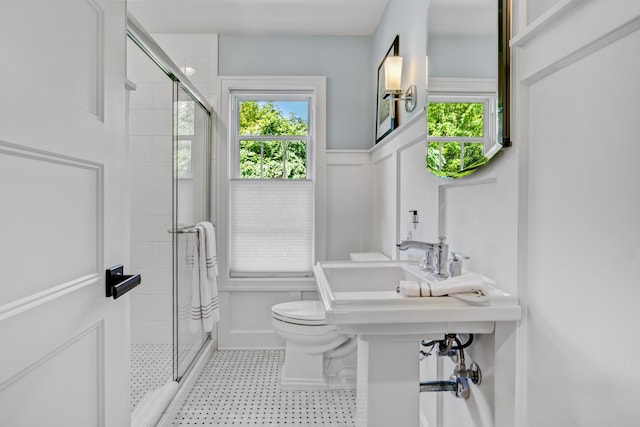 283 Wiley Rd, Douglas, MI 49406 - bathroom with a stall shower, toilet, plenty of natural light, and wainscoting
