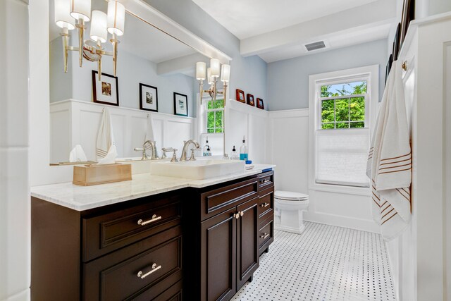 283 Wiley Rd, Douglas, MI 49406 - bathroom with a wainscoted wall, vanity, toilet, a decorative wall, and a chandelier