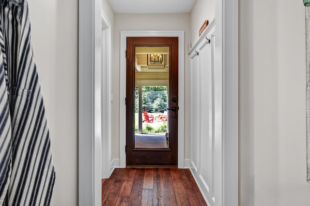283 Wiley Rd, Douglas, MI 49406 - doorway featuring dark wood finished floors and baseboards