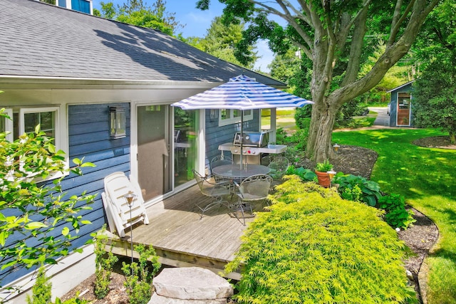 283 Wiley Rd, Douglas, MI 49406 - wooden terrace with a yard and outdoor dining area