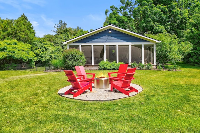 283 Wiley Rd, Douglas, MI 49406 - rear view of house with a sunroom and an outdoor fire pit