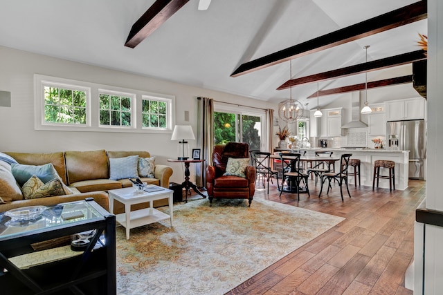 283 Wiley Rd, Douglas, MI 49406 - living room featuring wood finished floors and a chandelier
