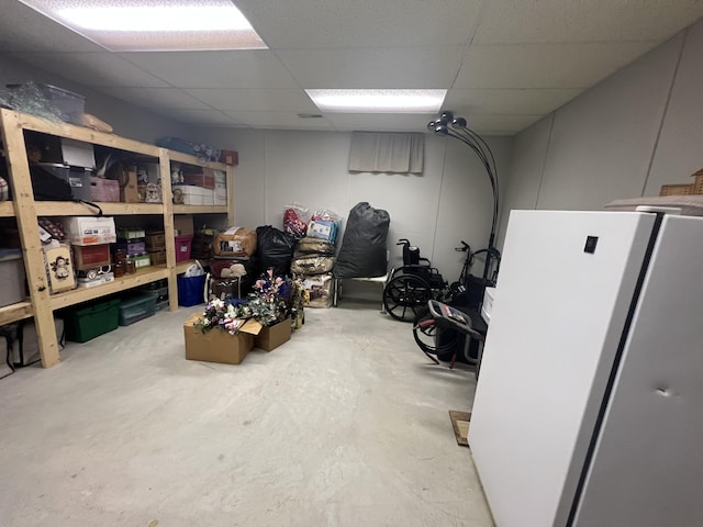 12050 S Ponderosa, Sand Lake, MI 49343 - finished below grade area with freestanding refrigerator and a drop ceiling