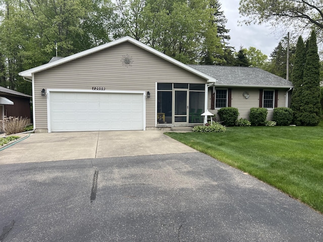 12050 S Ponderosa, Sand Lake, MI 49343 - ranch-style home with a front lawn, driveway, and a sunroom