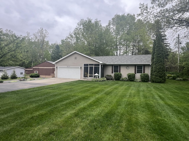12050 S Ponderosa, Sand Lake, MI 49343 - ranch-style house with a garage, driveway, a front yard, and a shingled roof