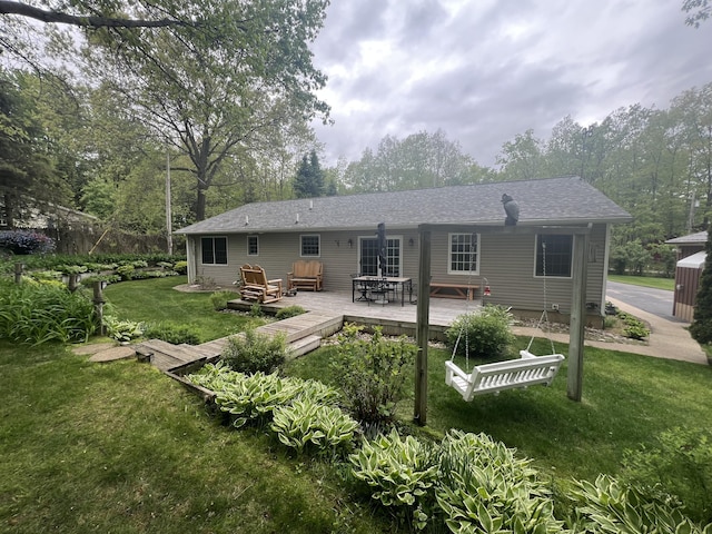 12050 S Ponderosa, Sand Lake, MI 49343 - rear view of property featuring a lawn, a deck, and roof with shingles