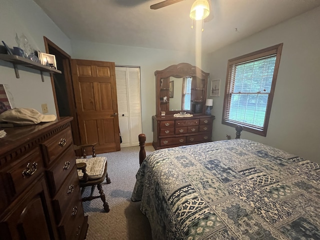 12050 S Ponderosa, Sand Lake, MI 49343 - bedroom with carpet, a closet, and a ceiling fan