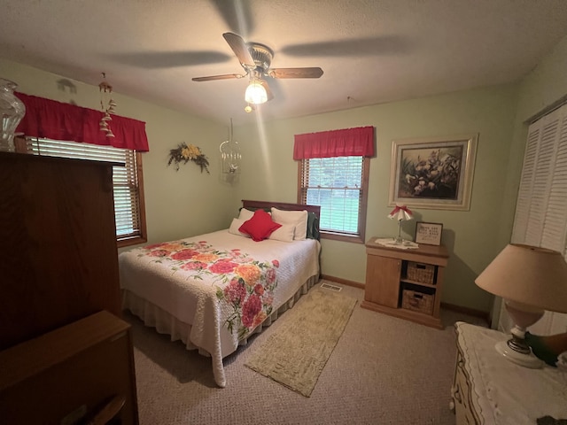 12050 S Ponderosa, Sand Lake, MI 49343 - bedroom featuring carpet floors, ceiling fan, and a closet