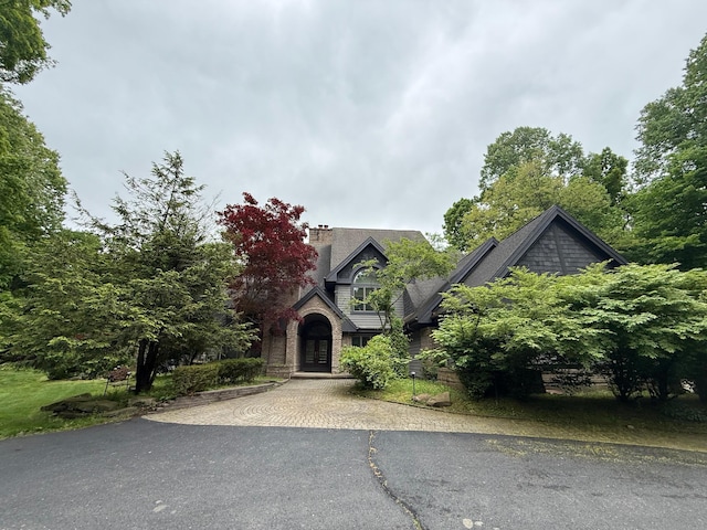 8180 N Ridge Rd, Canton, MI 48187 - view of front facade featuring french doors, asphalt driveway, and a chimney