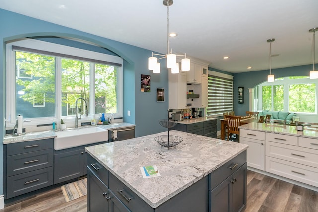 10543 Lakeshore Dr, West Olive, MI 49460 - kitchen with a sink, a center island, dark wood-style floors, plenty of natural light, and recessed lighting