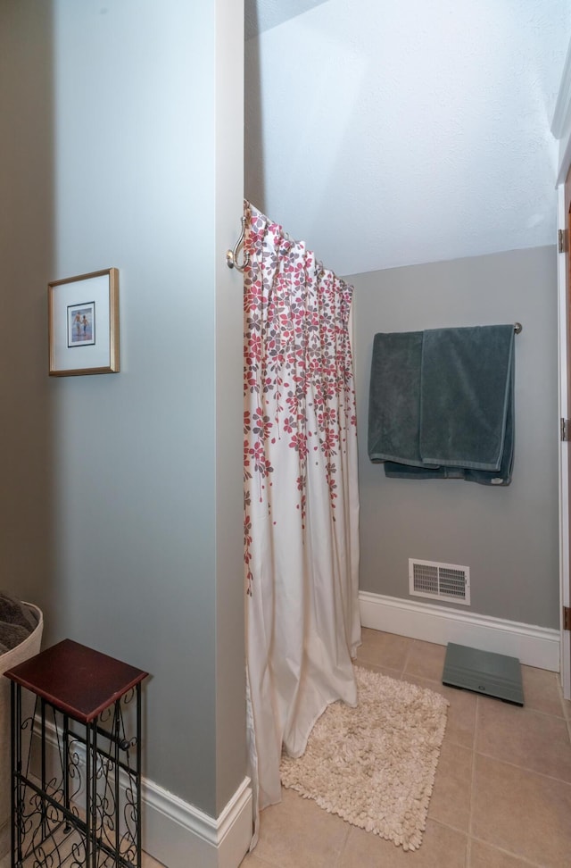 10543 Lakeshore Dr, West Olive, MI 49460 - bathroom featuring baseboards and tile patterned flooring