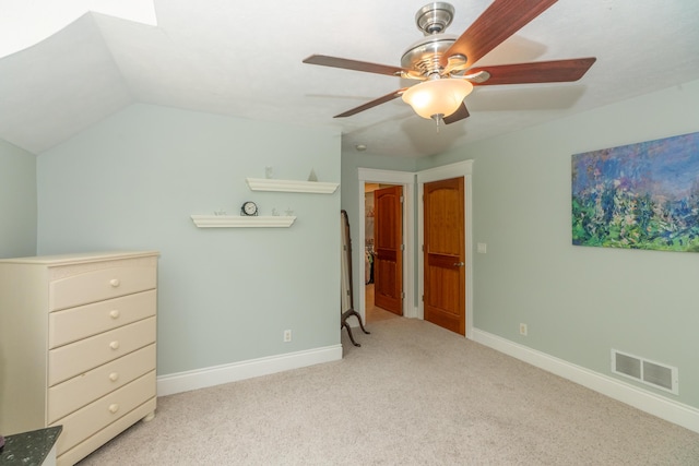 10543 Lakeshore Dr, West Olive, MI 49460 - carpeted bedroom with baseboards, ceiling fan, and vaulted ceiling