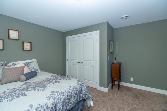 10543 Lakeshore Dr, West Olive, MI 49460 - carpeted bedroom featuring a closet and baseboards