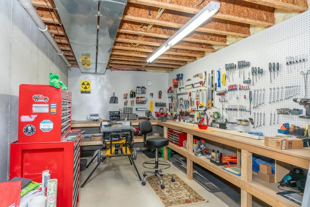 10543 Lakeshore Dr, West Olive, MI 49460 - miscellaneous room with a workshop area and concrete floors