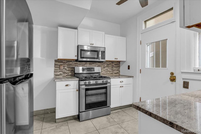 756 Delaware St, Detroit, MI 48202 - kitchen featuring stainless steel appliances, tasteful backsplash, white cabinetry, and ceiling fan