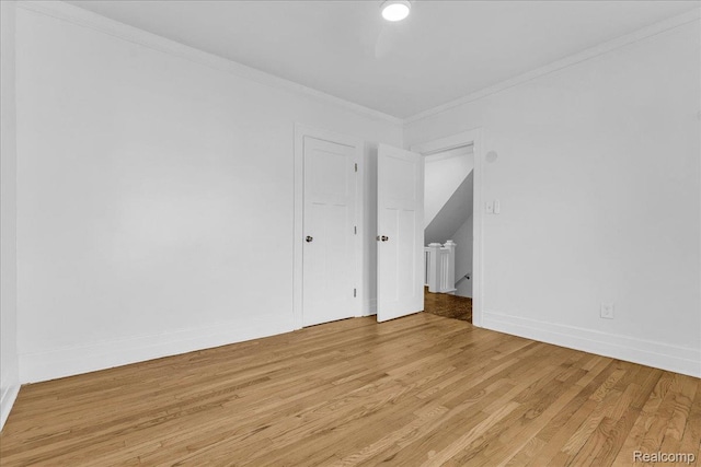 756 Delaware St, Detroit, MI 48202 - empty room with light wood-style floors, ornamental molding, and baseboards