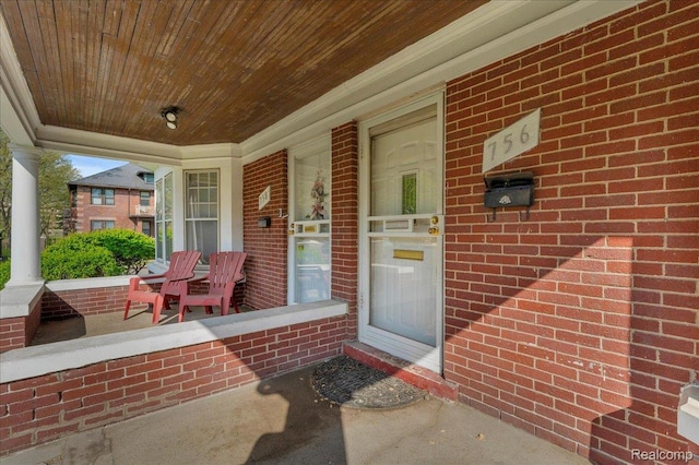 756 Delaware St, Detroit, MI 48202 - property entrance featuring a porch and brick siding